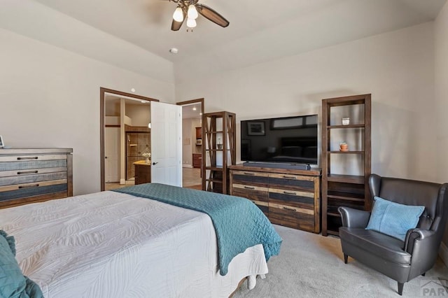 carpeted bedroom featuring a ceiling fan and connected bathroom