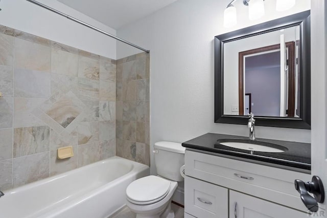 full bath with vanity, toilet, and bathing tub / shower combination