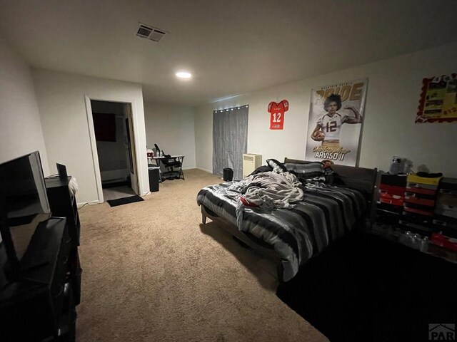 carpeted bedroom featuring recessed lighting and visible vents