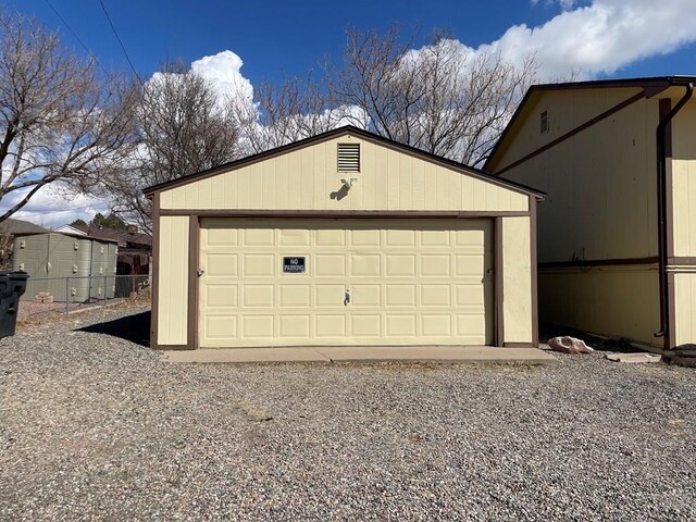 detached garage with fence