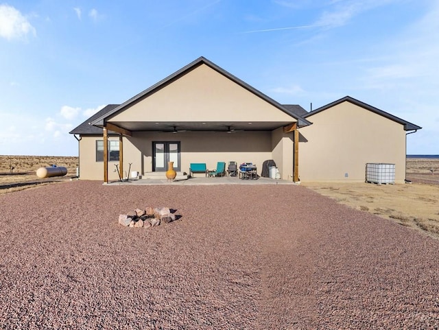 1855 N Buckboard Ave, Pueblo West, CO 81007 - back of house with a ceiling fan, stucco siding, and a patio
