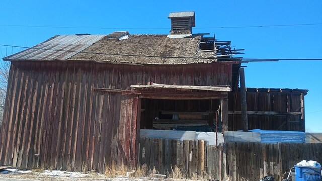 view of side of property with fence