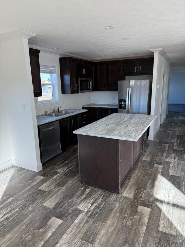 kitchen featuring dark brown cabinets, appliances with stainless steel finishes, dark wood-style flooring, and a center island