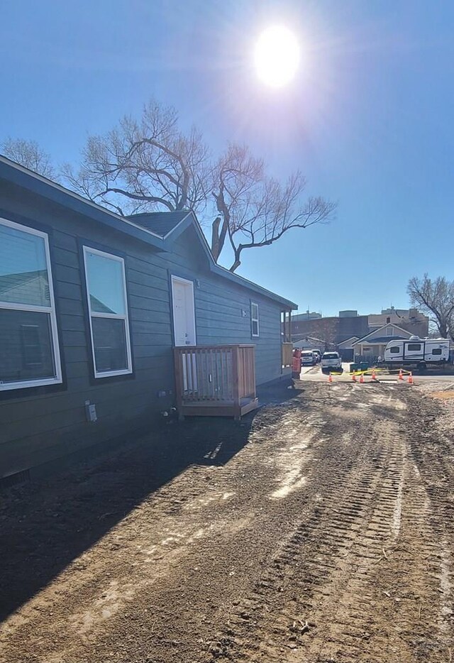 view of property exterior with a residential view