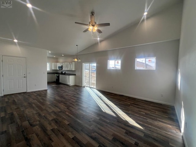 unfurnished living room featuring a ceiling fan, dark wood-style floors, baseboards, high vaulted ceiling, and recessed lighting