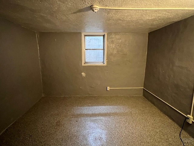 basement with a textured ceiling