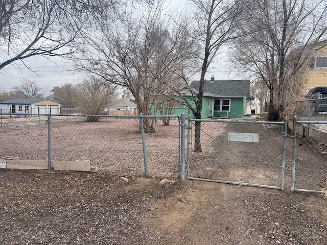 view of yard featuring a fenced front yard and a gate