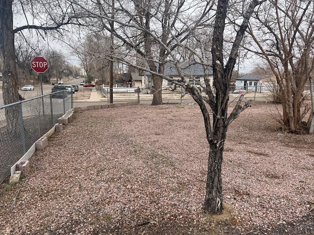 view of yard with fence and a residential view