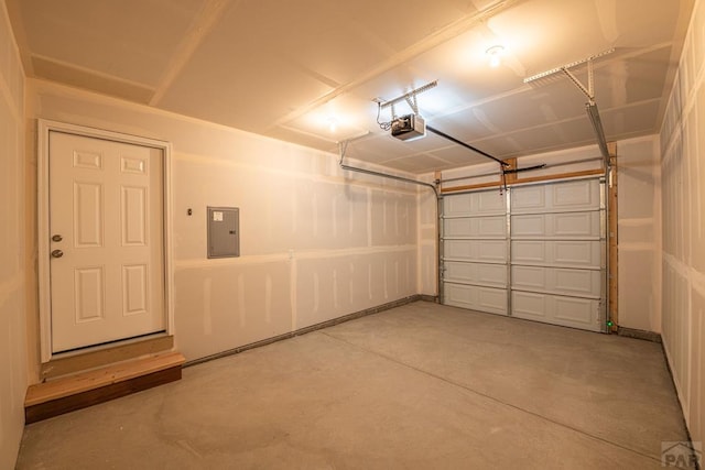 garage with electric panel and a garage door opener