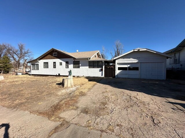 single story home with a garage and driveway