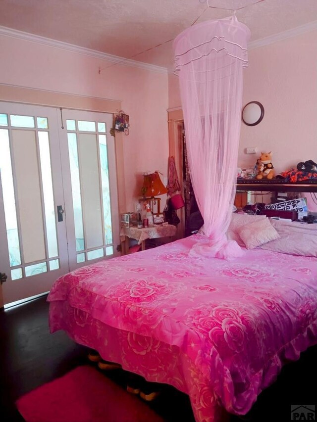 bedroom with crown molding