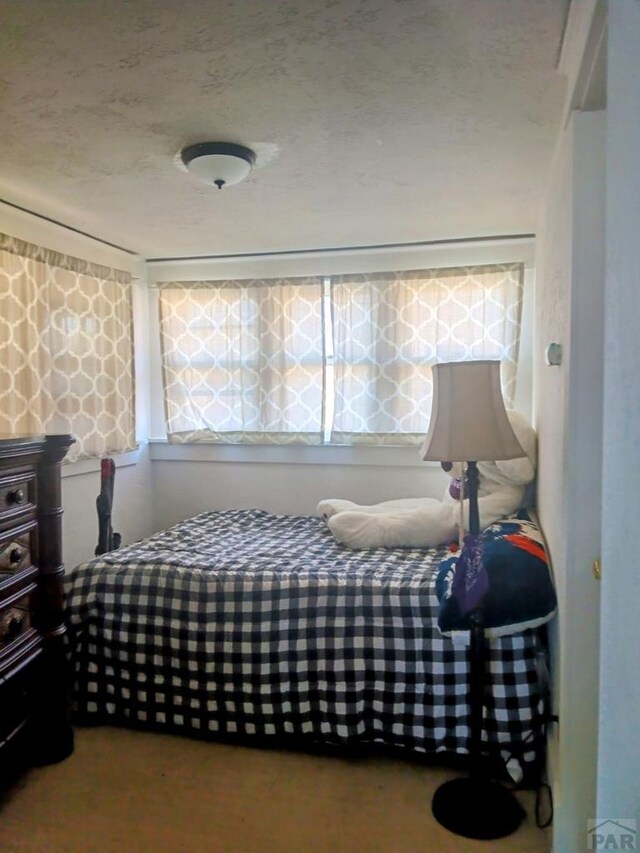 bedroom with a textured ceiling