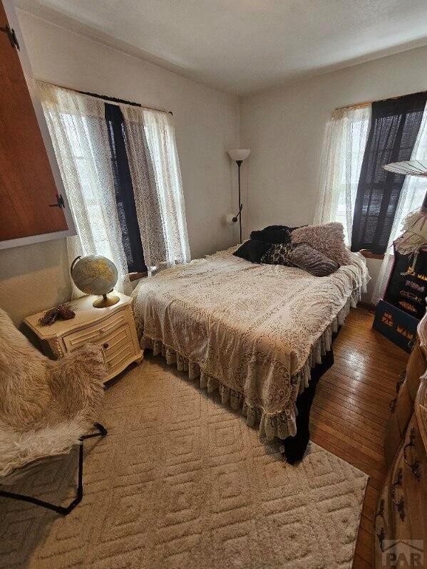 bedroom with wood finished floors
