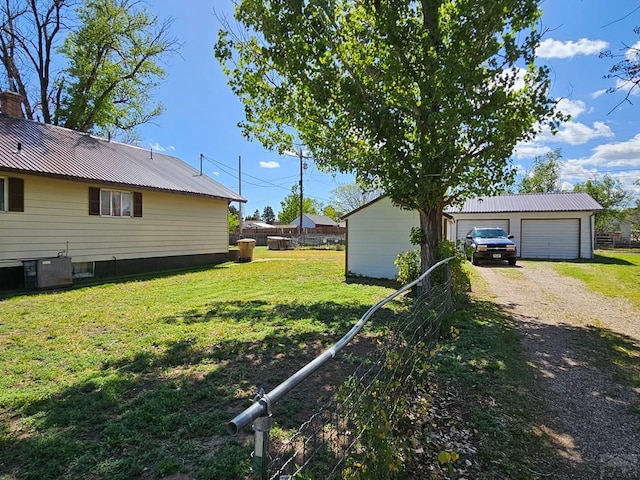 425 Randolph St, Pritchett, CO 81064 - view of yard with cooling unit, an outdoor structure, fence, and a detached garage
