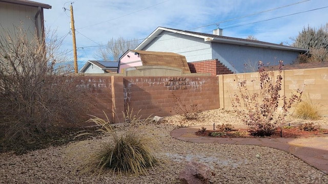 community / neighborhood sign with fence