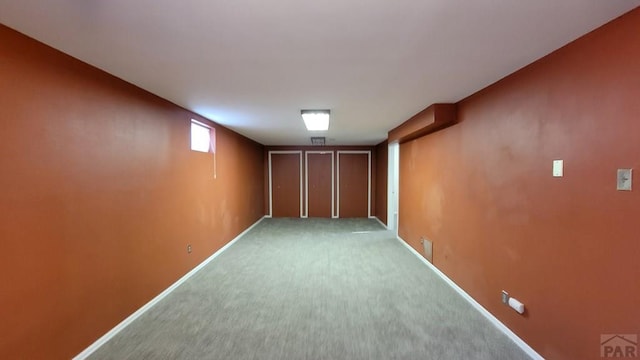 basement with carpet floors and baseboards