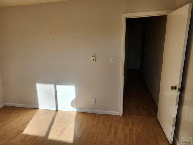 7787 State Highway 78, Beulah, CO 81023 - empty room with wood finished floors and baseboards