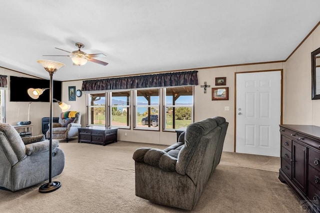 181 6th St, Penrose, CO 81240 - living room featuring light carpet, a ceiling fan, and ornamental molding