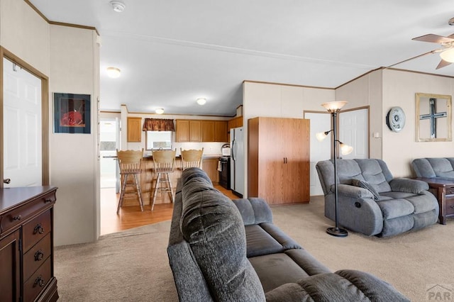 181 6th St, Penrose, CO 81240 - living room with light carpet, a ceiling fan, and crown molding