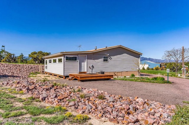 181 6th St, Penrose, CO 81240 - rear view of property with a deck with mountain view