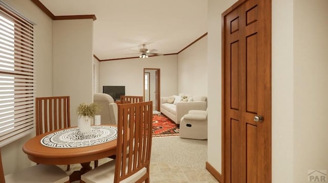 dining room with ornamental molding and ceiling fan