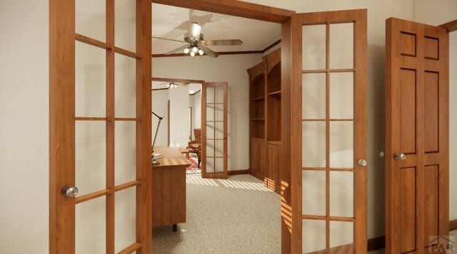 corridor with light colored carpet and french doors