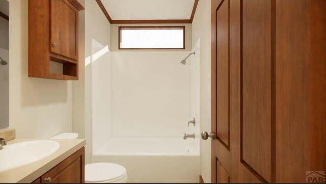 full bathroom featuring  shower combination, vanity, toilet, and crown molding
