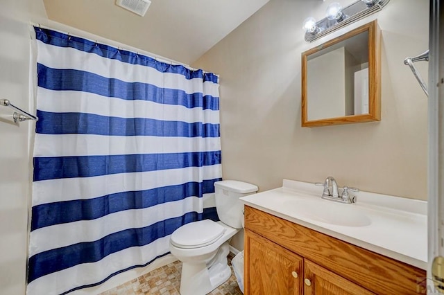 1493 N Challenger Ln, Pueblo West, CO 81007 - full bath featuring toilet, vanity, and a shower with curtain