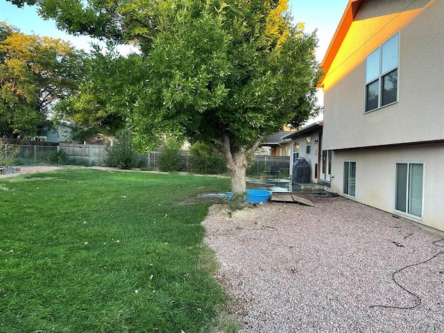 view of yard with a fenced backyard