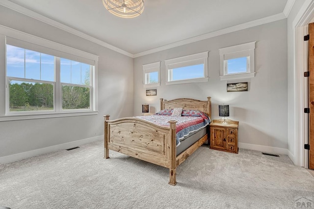 bedroom featuring baseboards, crown molding, and light colored carpet