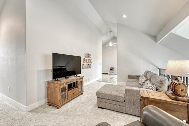 living area featuring visible vents, light carpet, baseboards, and ceiling fan