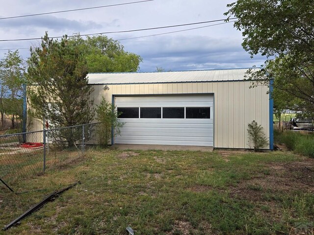 detached garage with fence