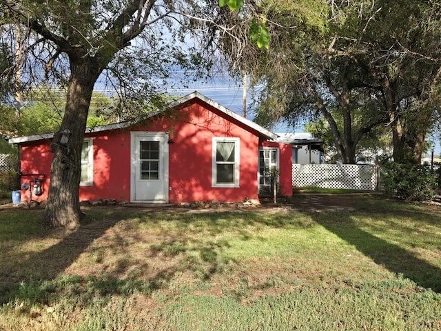 view of outbuilding featuring fence