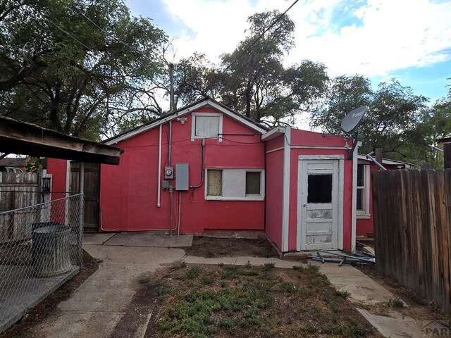 view of outdoor structure featuring fence