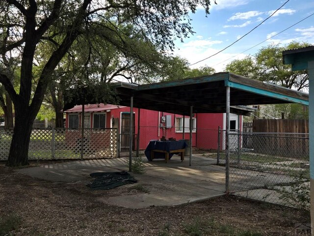 view of parking with a fenced front yard