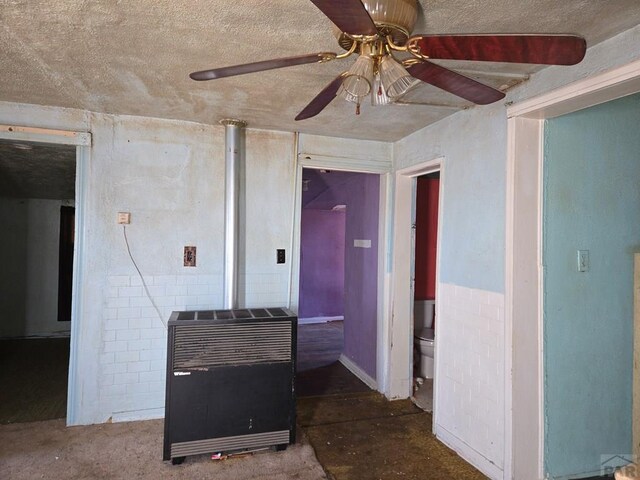 kitchen with a ceiling fan and heating unit