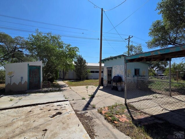 view of yard with fence and a patio