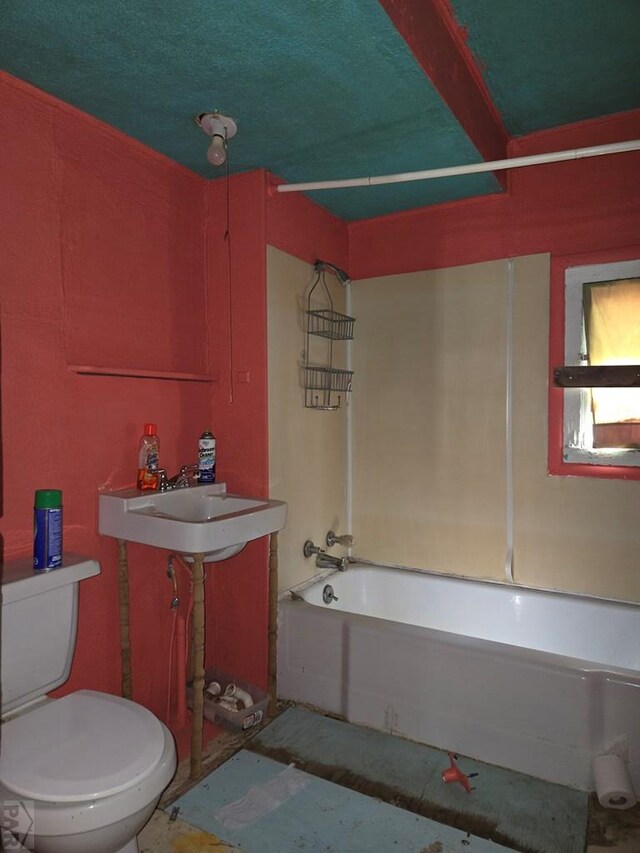 full bathroom with tub / shower combination, a sink, and toilet