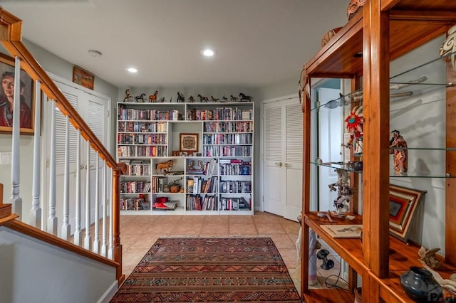 living area featuring recessed lighting and light tile patterned flooring