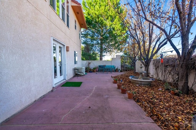 view of patio with a fenced backyard and french doors