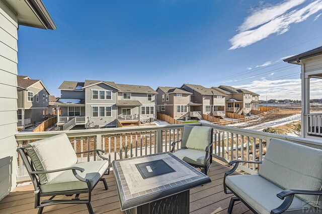 wooden terrace featuring a residential view