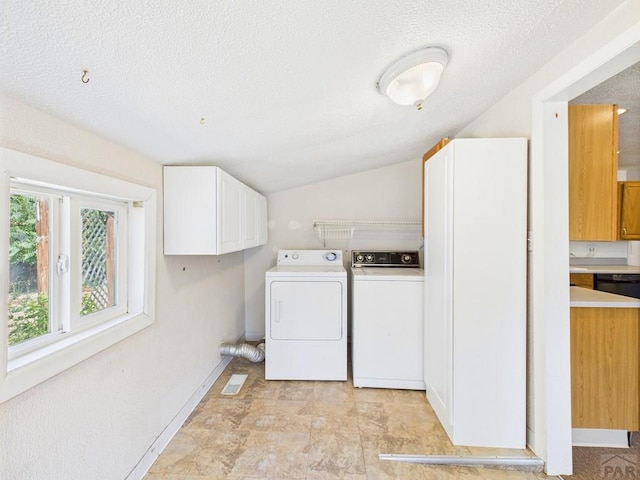 705 Euclid Ave, Pueblo, CO 81004 - laundry room featuring cabinet space, independent washer and dryer, and a textured ceiling