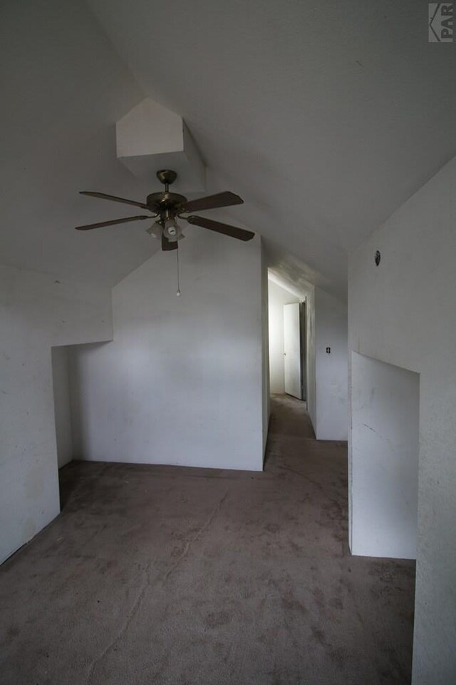 additional living space with vaulted ceiling and carpet floors