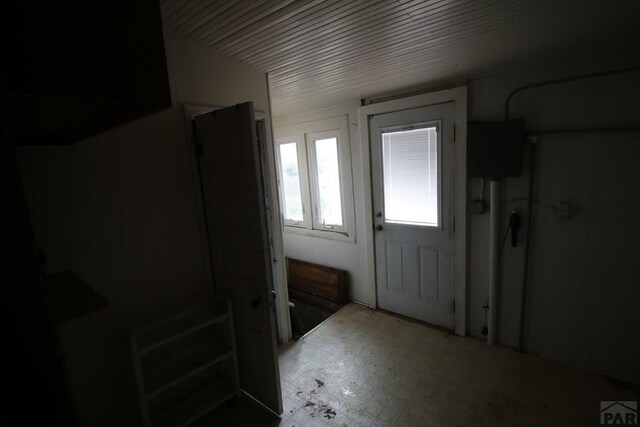 doorway with tile patterned floors