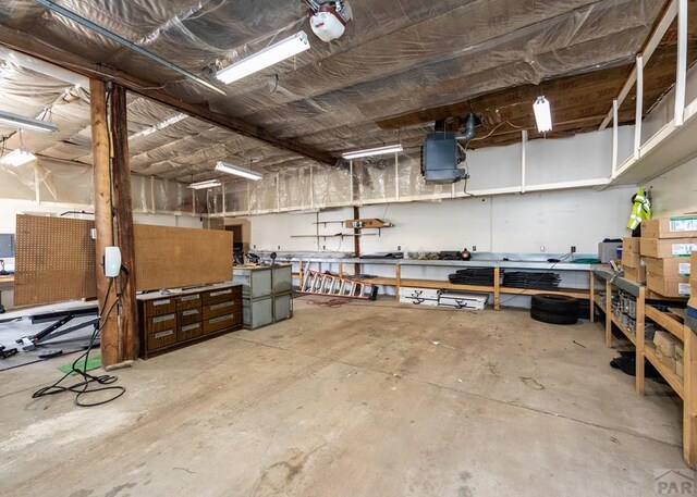 11210 Eggar Dr, Peyton, CO 80831 - garage with a workshop area
