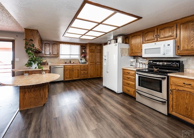 11210 Eggar Dr, Peyton, CO 80831 - kitchen with light countertops, brown cabinets, and stainless steel appliances