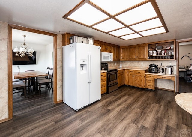 11210 Eggar Dr, Peyton, CO 80831 - kitchen featuring light countertops, open shelves, a chandelier, white appliances, and dark wood-style flooring