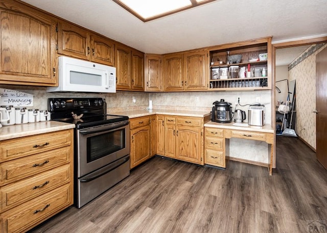 11210 Eggar Dr, Peyton, CO 80831 - kitchen featuring light countertops, dark wood-type flooring, open shelves, white microwave, and electric range