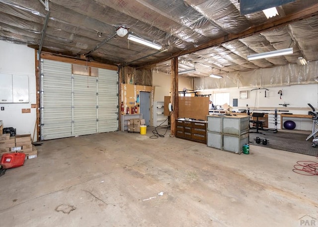 11210 Eggar Dr, Peyton, CO 80831 - garage featuring a workshop area