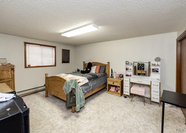 11210 Eggar Dr, Peyton, CO 80831 - bedroom with carpet floors, a baseboard heating unit, and a textured ceiling